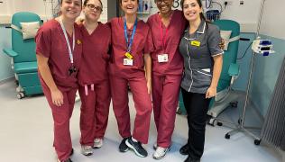 Five of the nurses in the varicose vein intervention service, standing together inside a hospital ward.