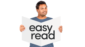 A man holds a booklet with the words 'easy read' on the cover
