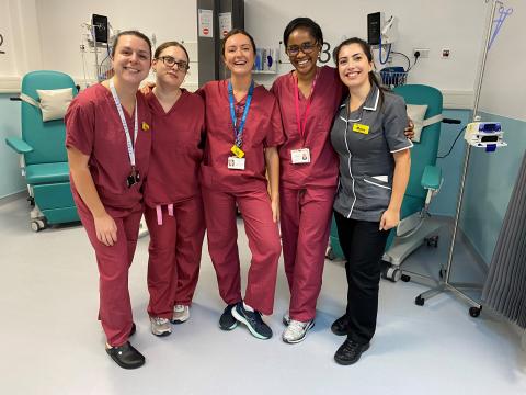 Five of the nurses in the varicose vein intervention service, standing together inside a hospital ward.