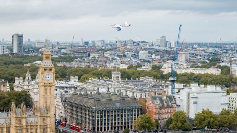 Photo of an NHS delivery drone in flight against the backdrop of Big Ben in London